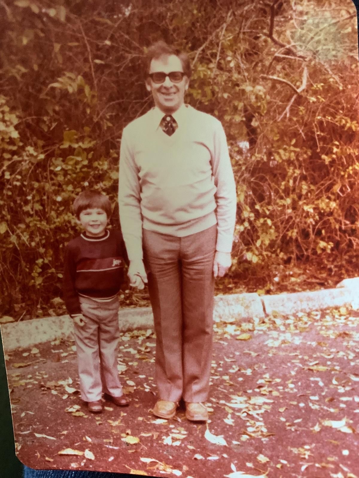 A baby James Lance (left) holding the hands of his father, Richard Lance (right)